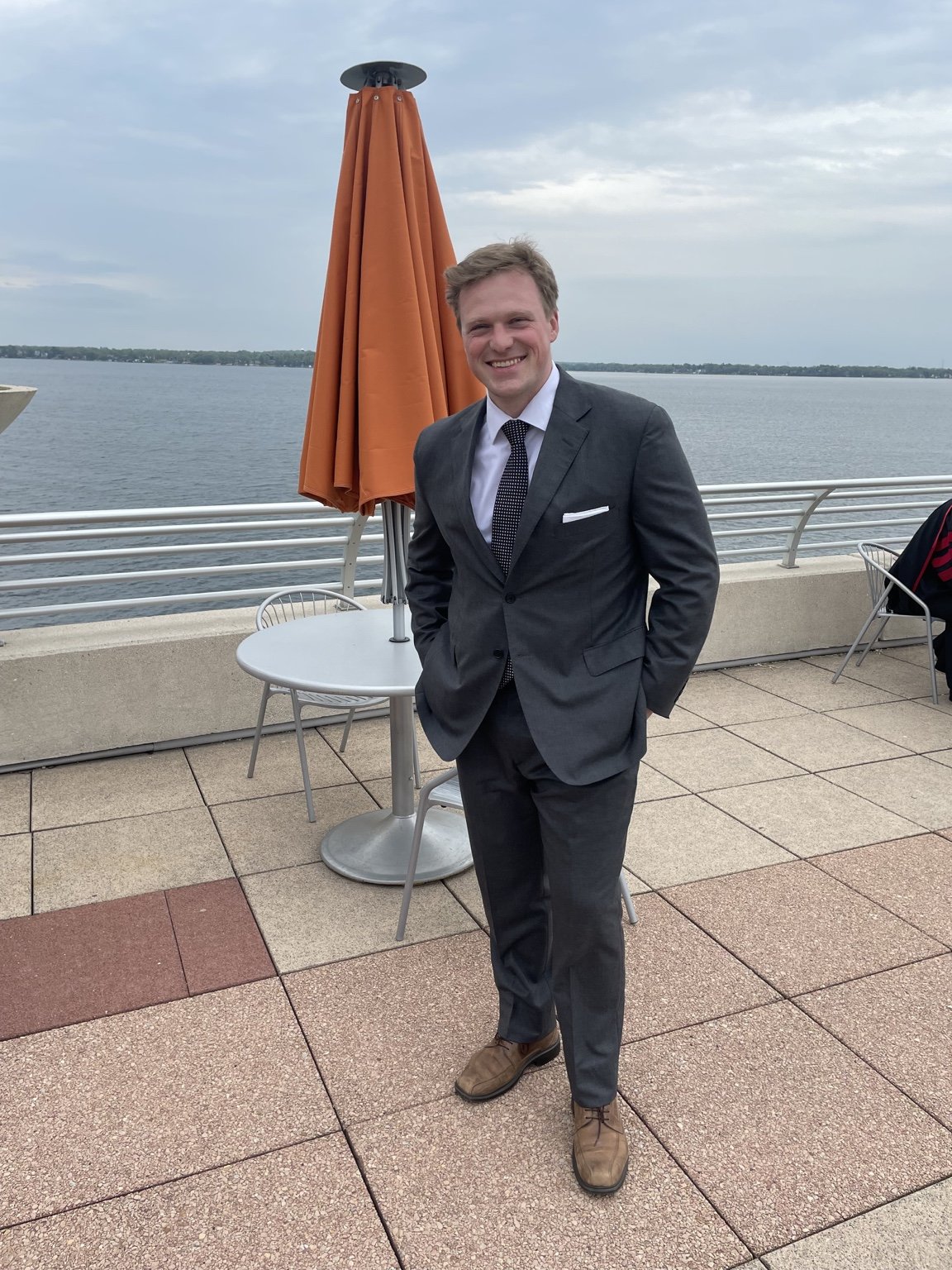 A PATTON client in tailored clothing beside the water.