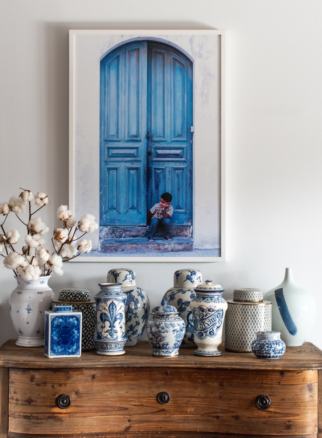 Susan Bradfield Photography, boy sitting in front of blue door in Morocco.jpeg