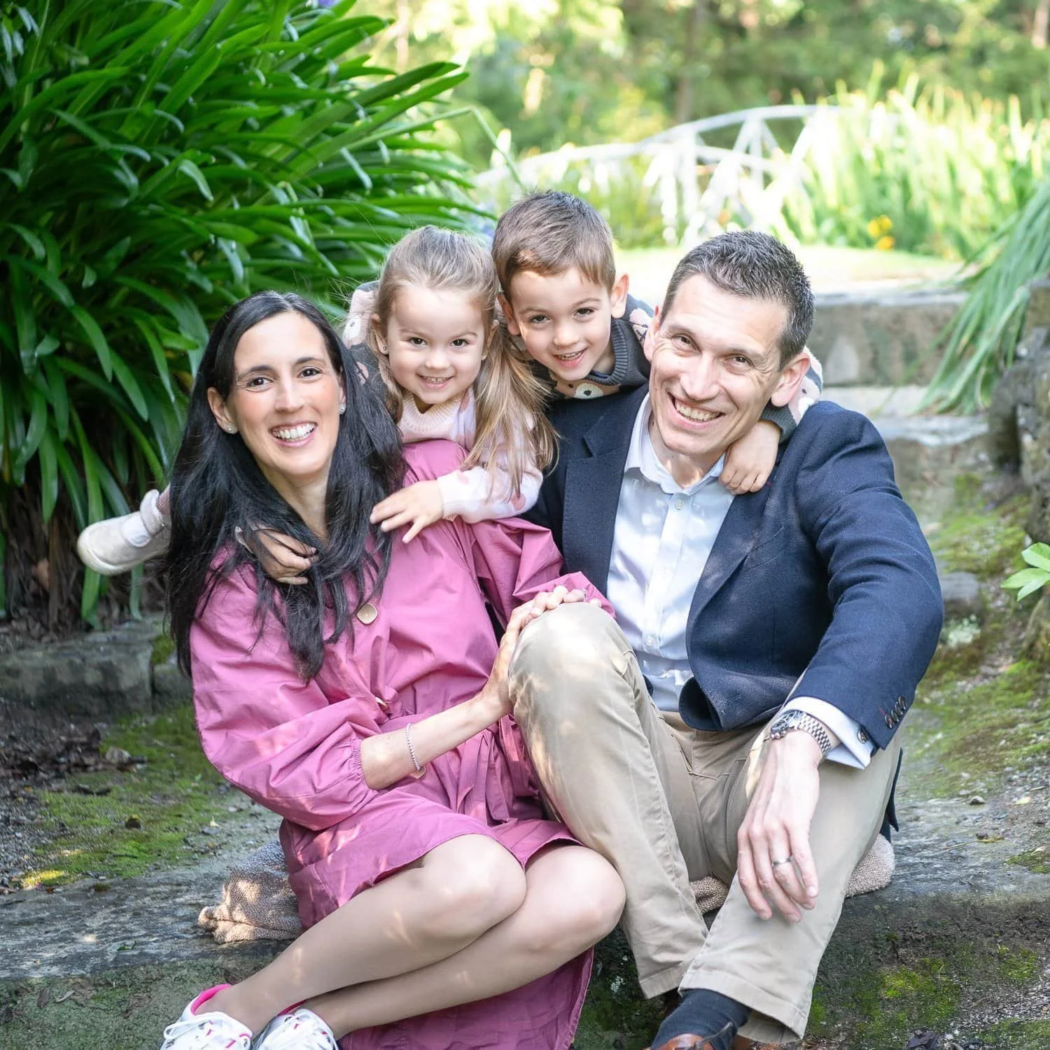 Family Photographer Melbourne image of happy family of four in a garden setting