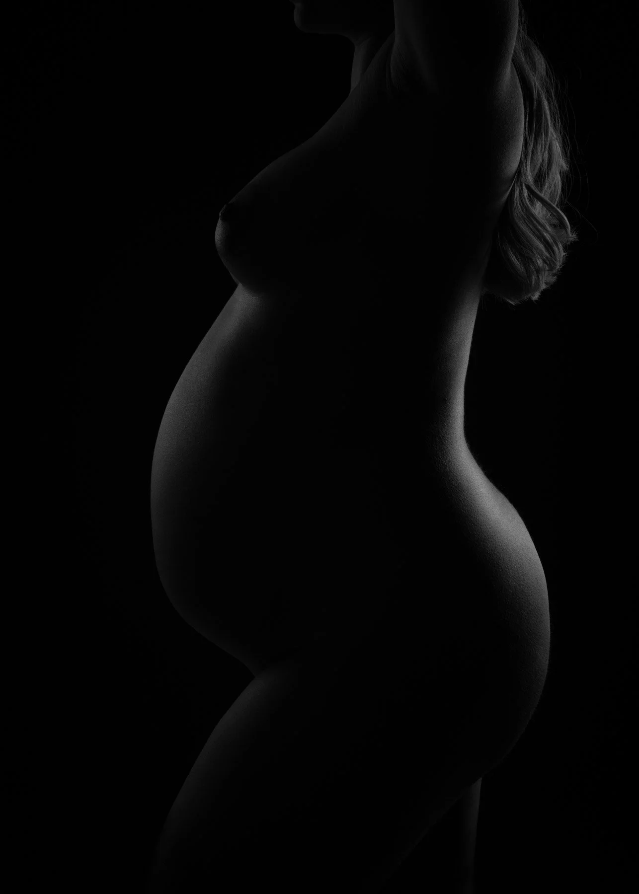 Susan Bradfield Photography image of a pregnant woman close up in monochrome