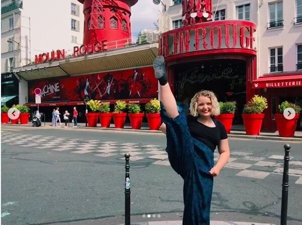 Caitlin outside of the Moulin Rouge in Paris