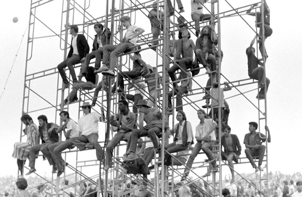 Fans at Woodstock chilling on scaffolding. Credit: Getty Images / Esquire