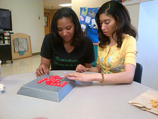 Community Place staff learning literacy games.jpg