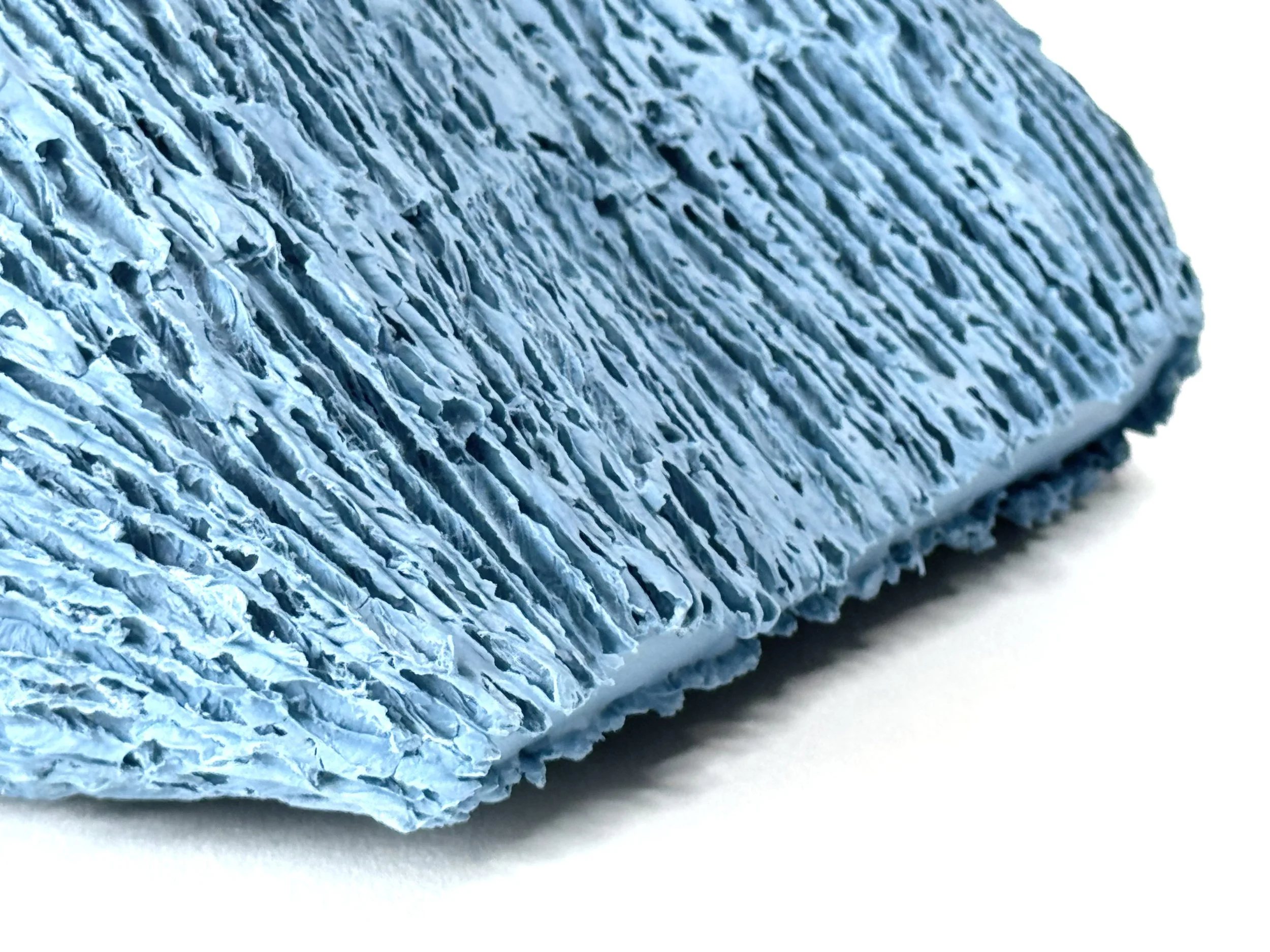 Paper porcelain sculpture with Porcelain de Limoges, colored with blue stains.