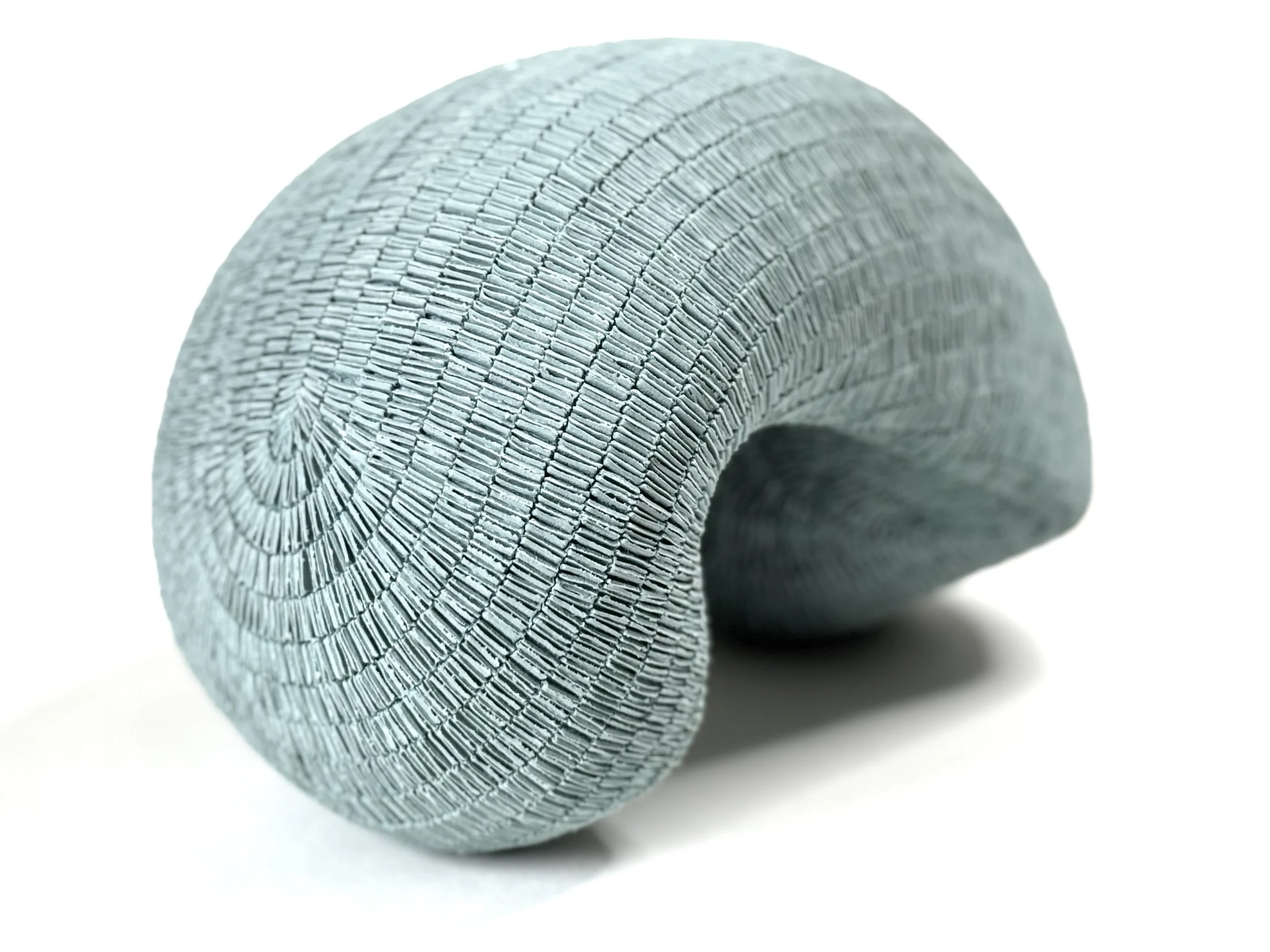 Paper porcelain sculpture colored with blue stains