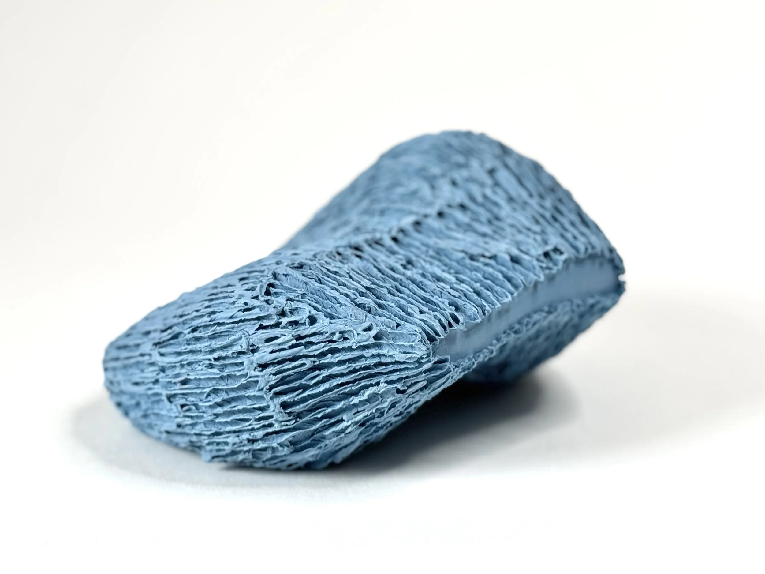 Paper porcelain sculpture with Porcelain de Limoges, colored with blue stains.