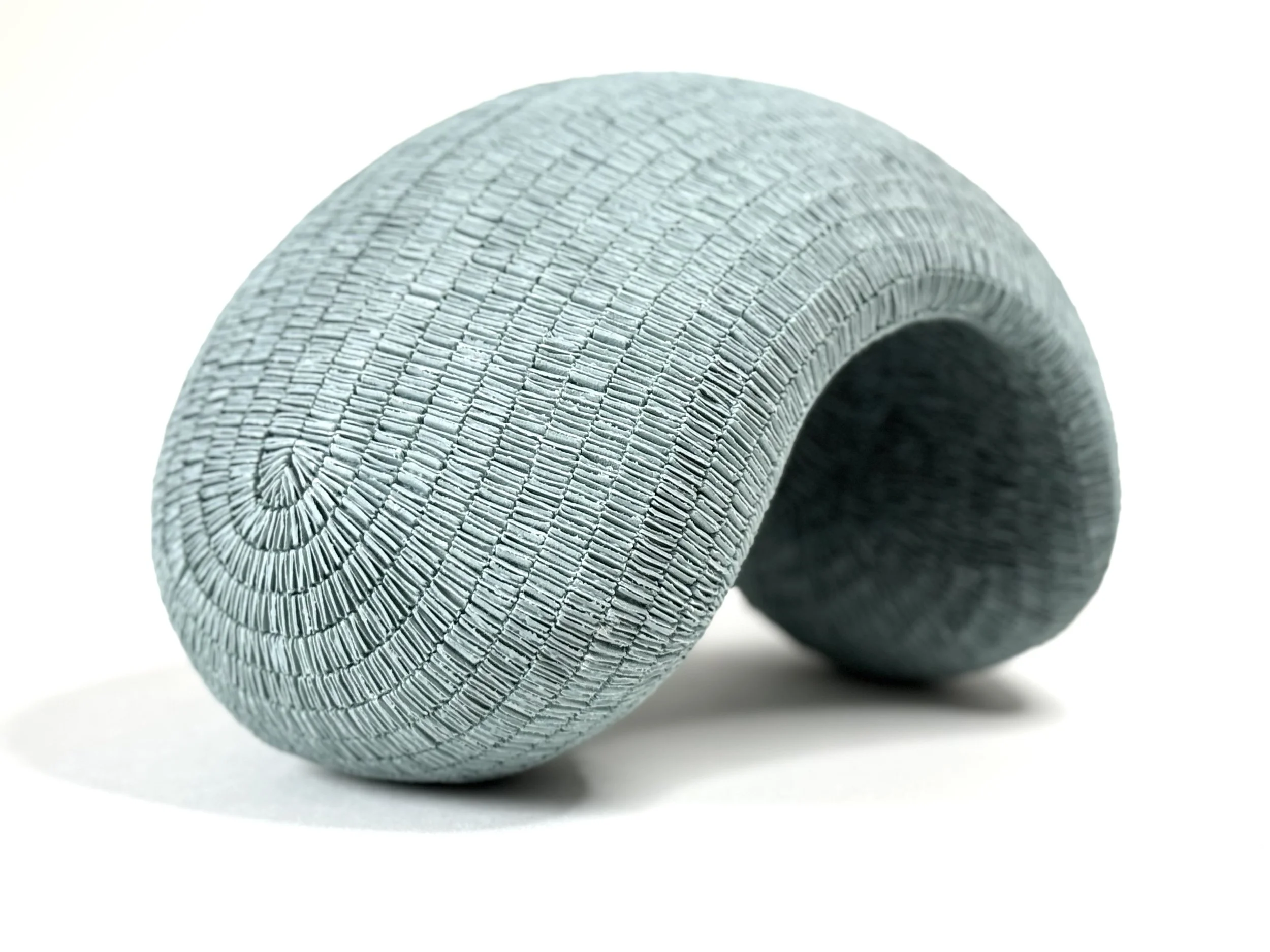 Paper porcelain sculpture colored with blue stains