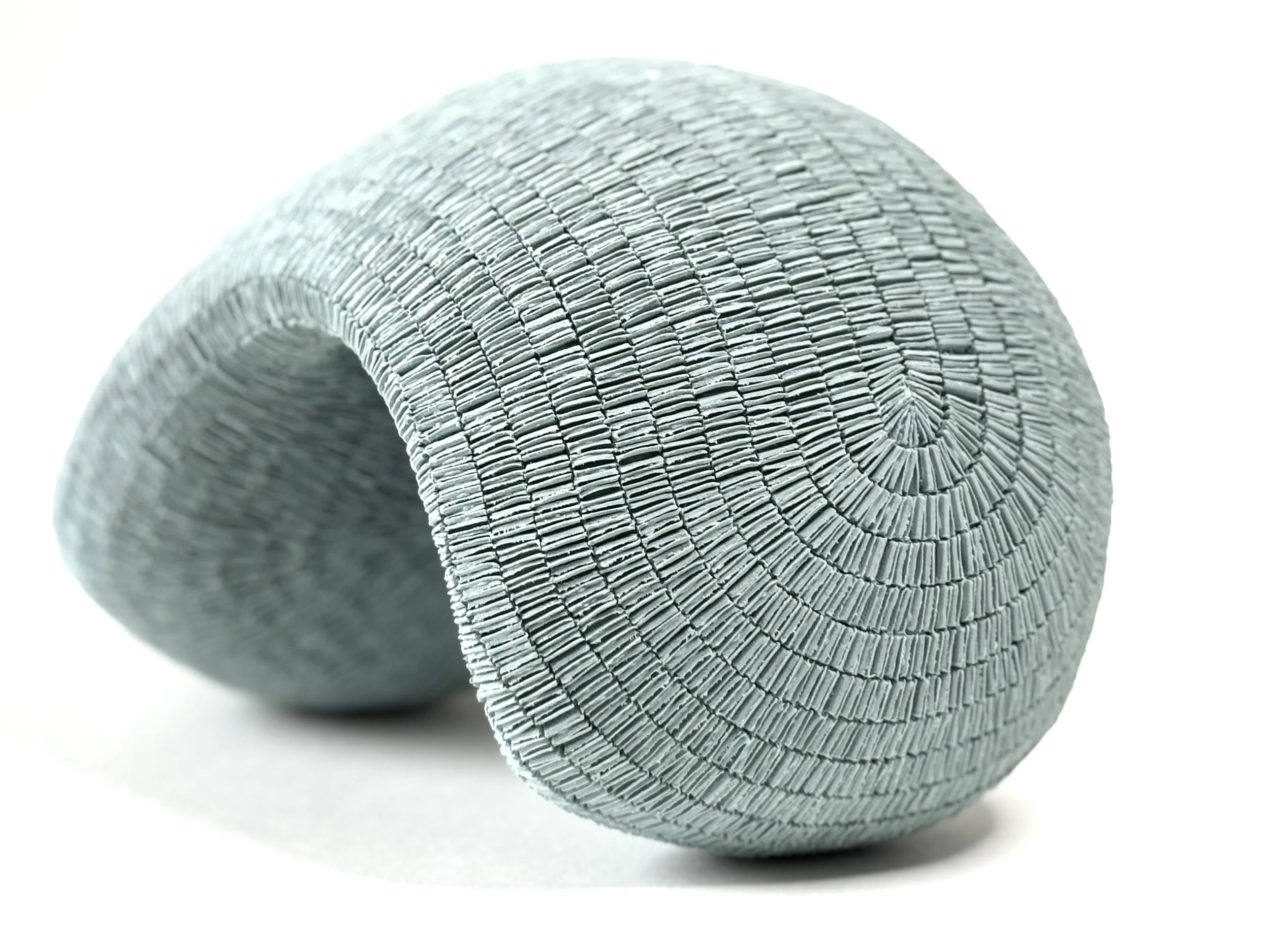 Paper porcelain sculpture colored with blue stains