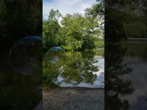 Slow motion bubble pop. (the left bubble)