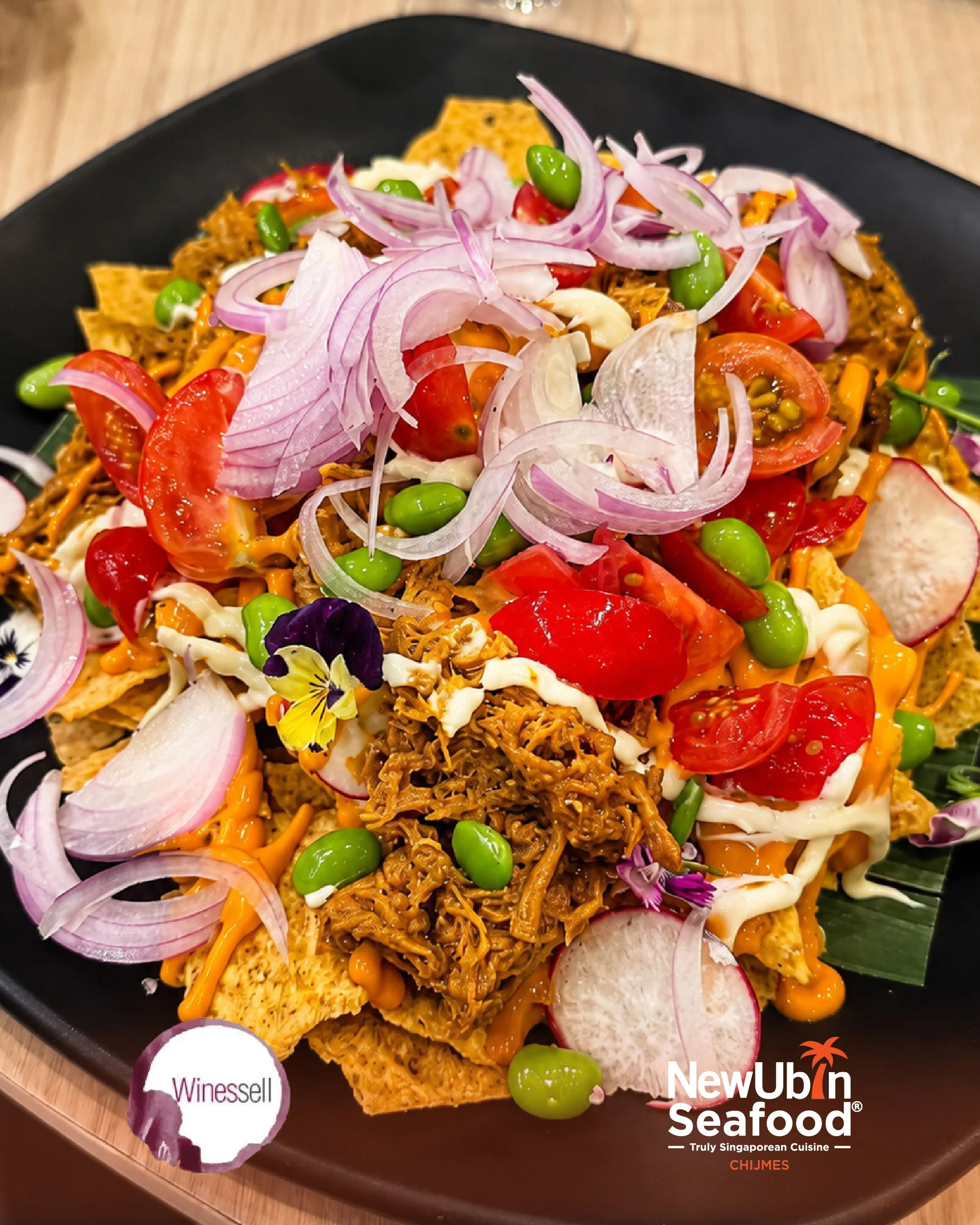 A plate of Truly Singaporean Hawker Classic served on a black tray.