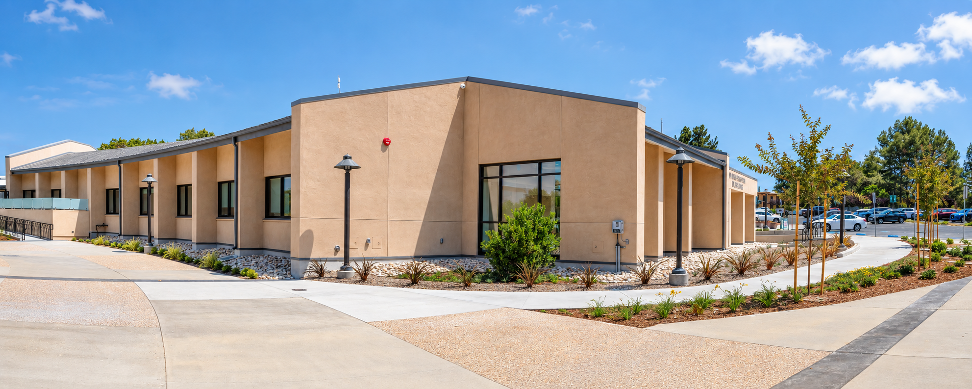 Panoramic coastal stucco building exterior.png
