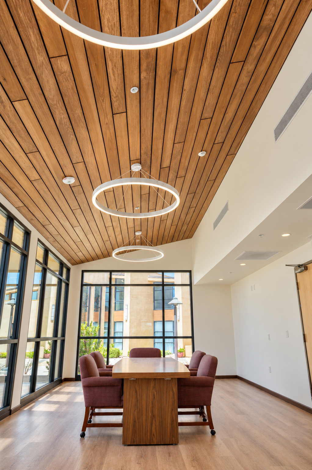 Wood ceiling and ring pendants.png