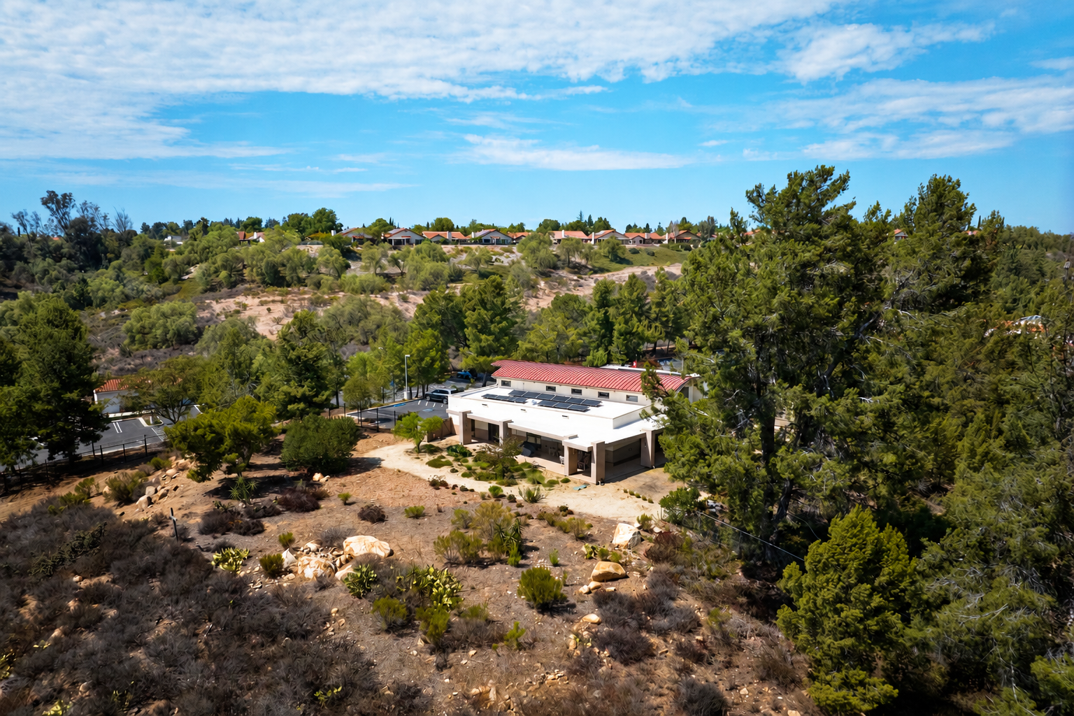 Red-roof rectory hillside aerial.png