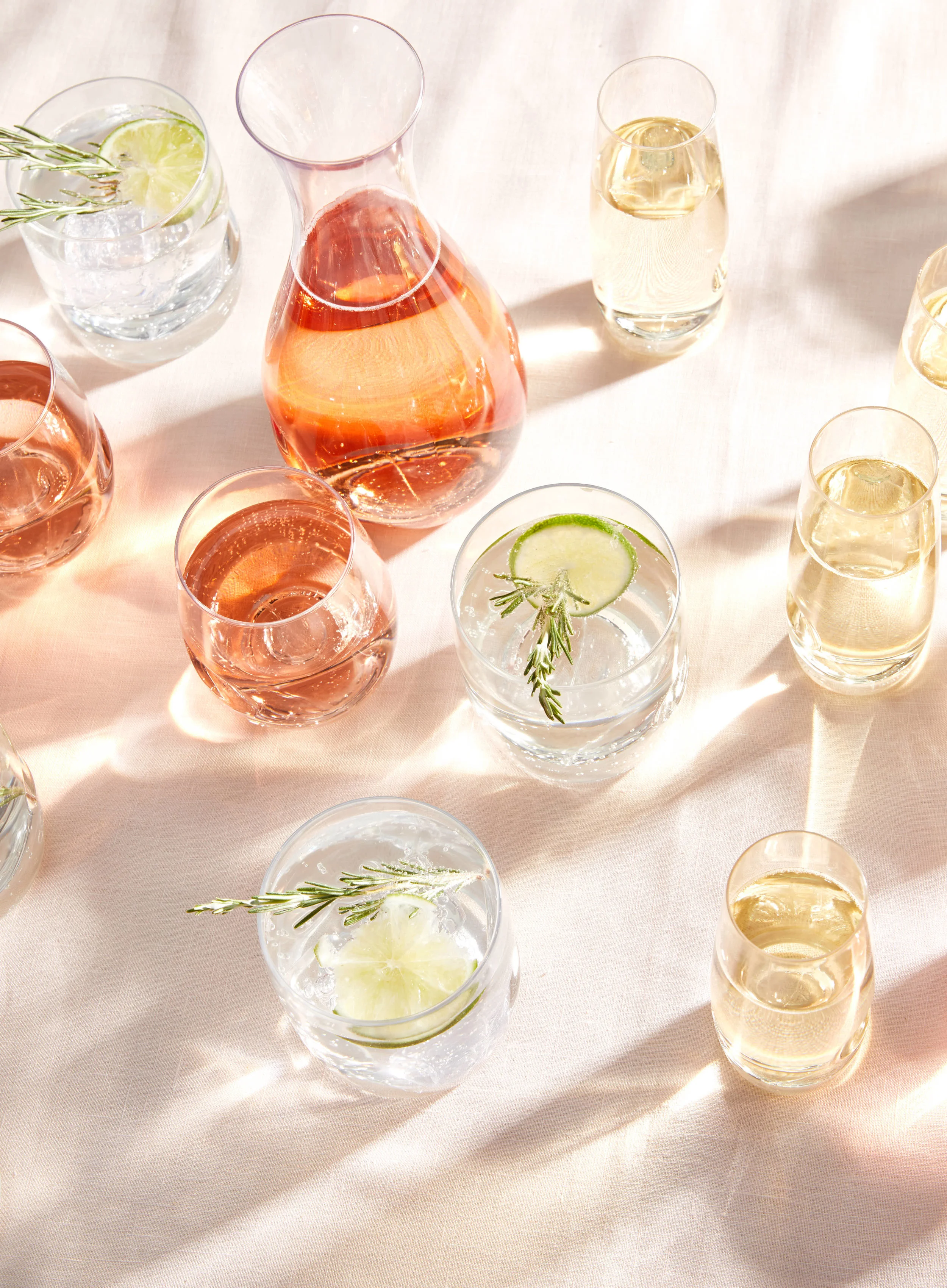 kate sears editorial nyc art director govino unbreakable wine glass decanter rosemary rose lime champagne brut sparkling light shadows event bar table