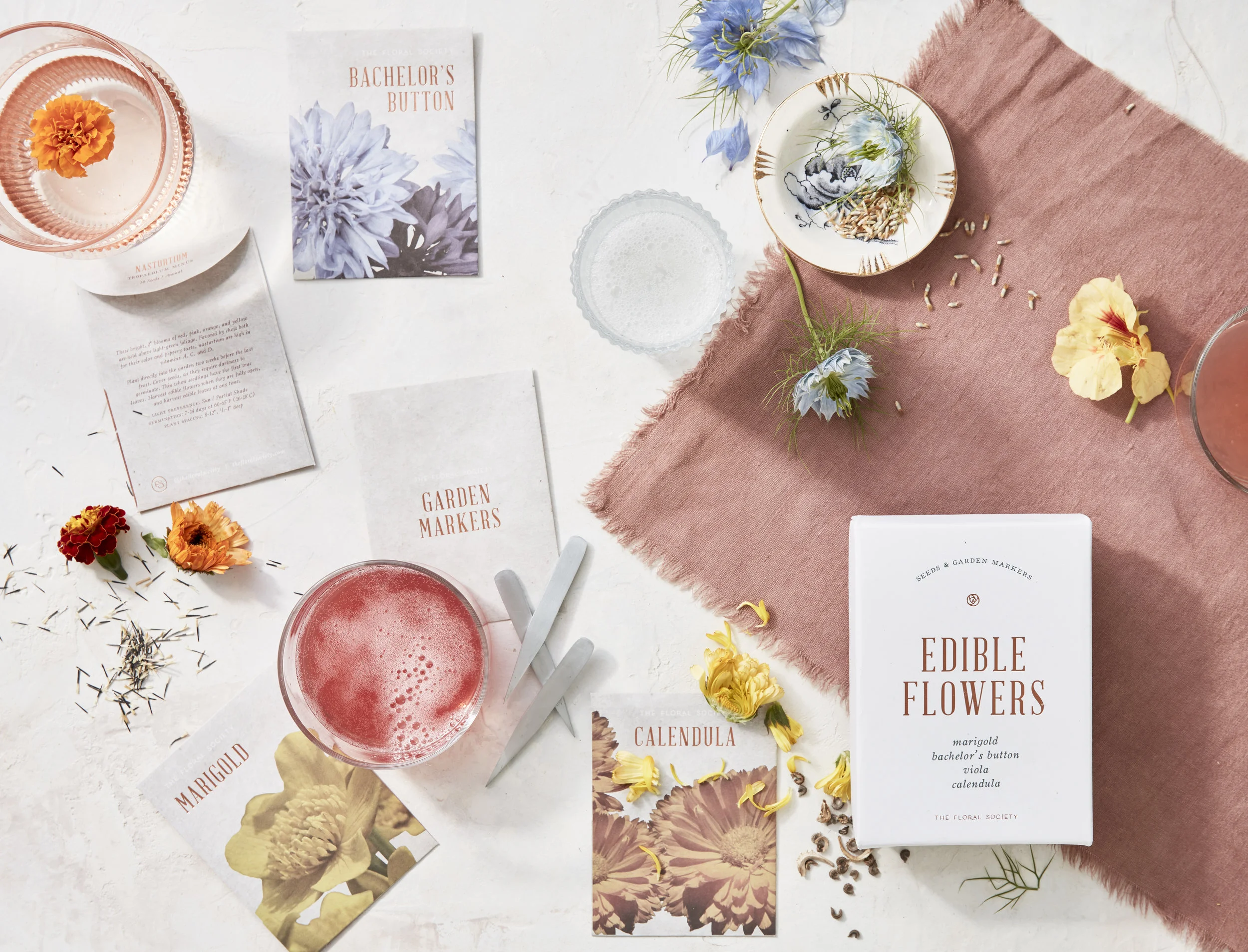 sierra steifman nyc art director photographer lifestyle editorial ayesha patel the floral society edible flowers box packaging design copper foil seeds cocktails drinks happy hour napkins graphic