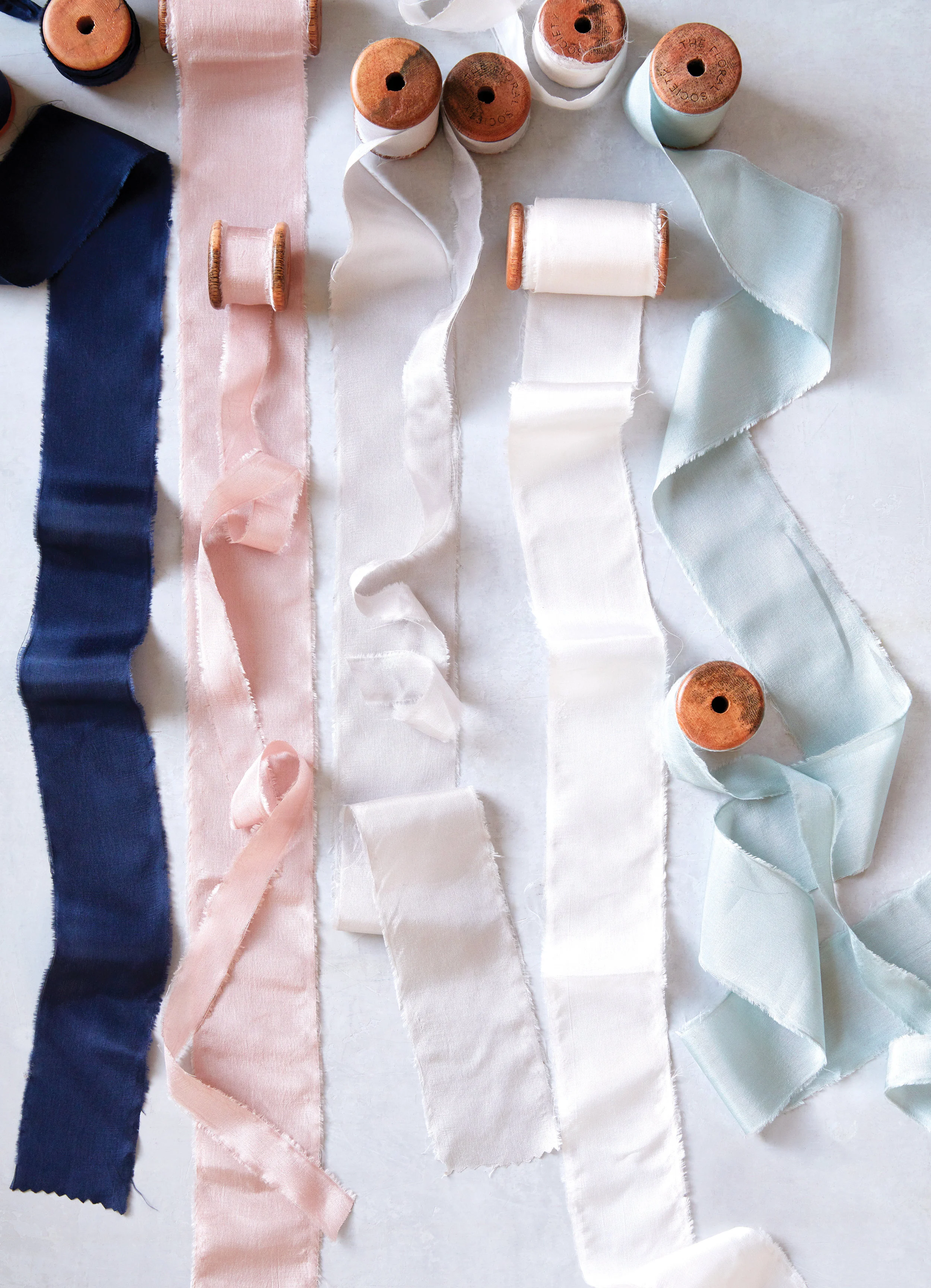 sierra steifman nyc art director photographer lifestyle editorial the floral society design silk ribbon midnight petal parchment greige wedding events decor bouquet craft gift wrap kate sears