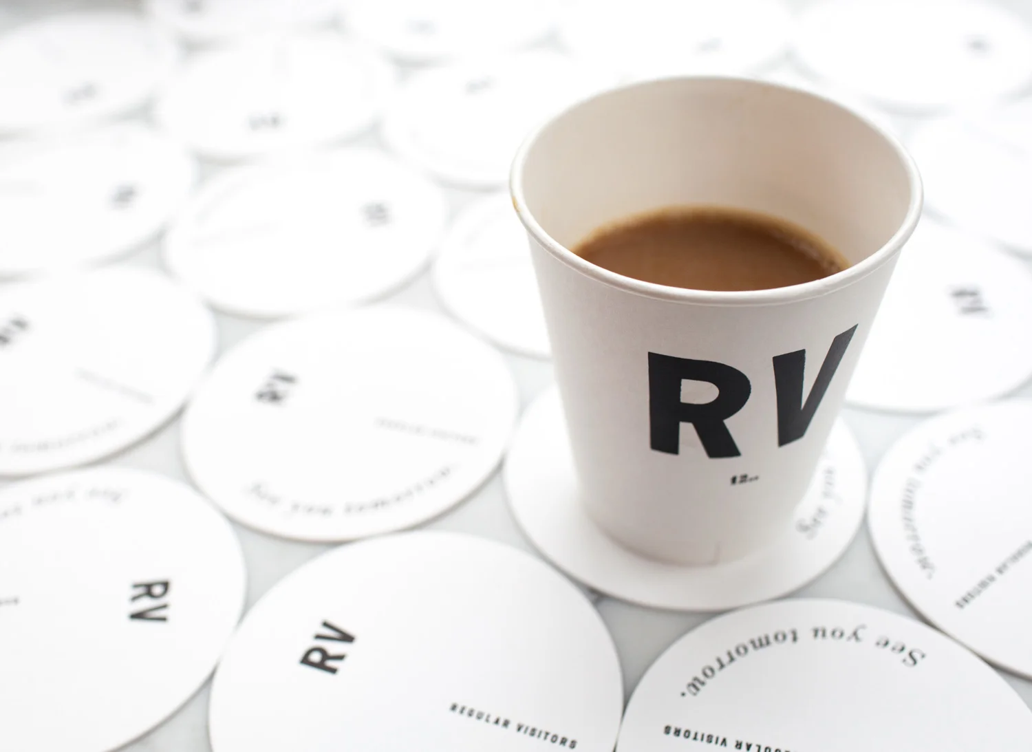 to-go aesthetic movement graphic designer nyc regular visitors design branding logo boerum hill brooklyn retail brick mortar black white typography RV coffee cup coaster see you tomorrow