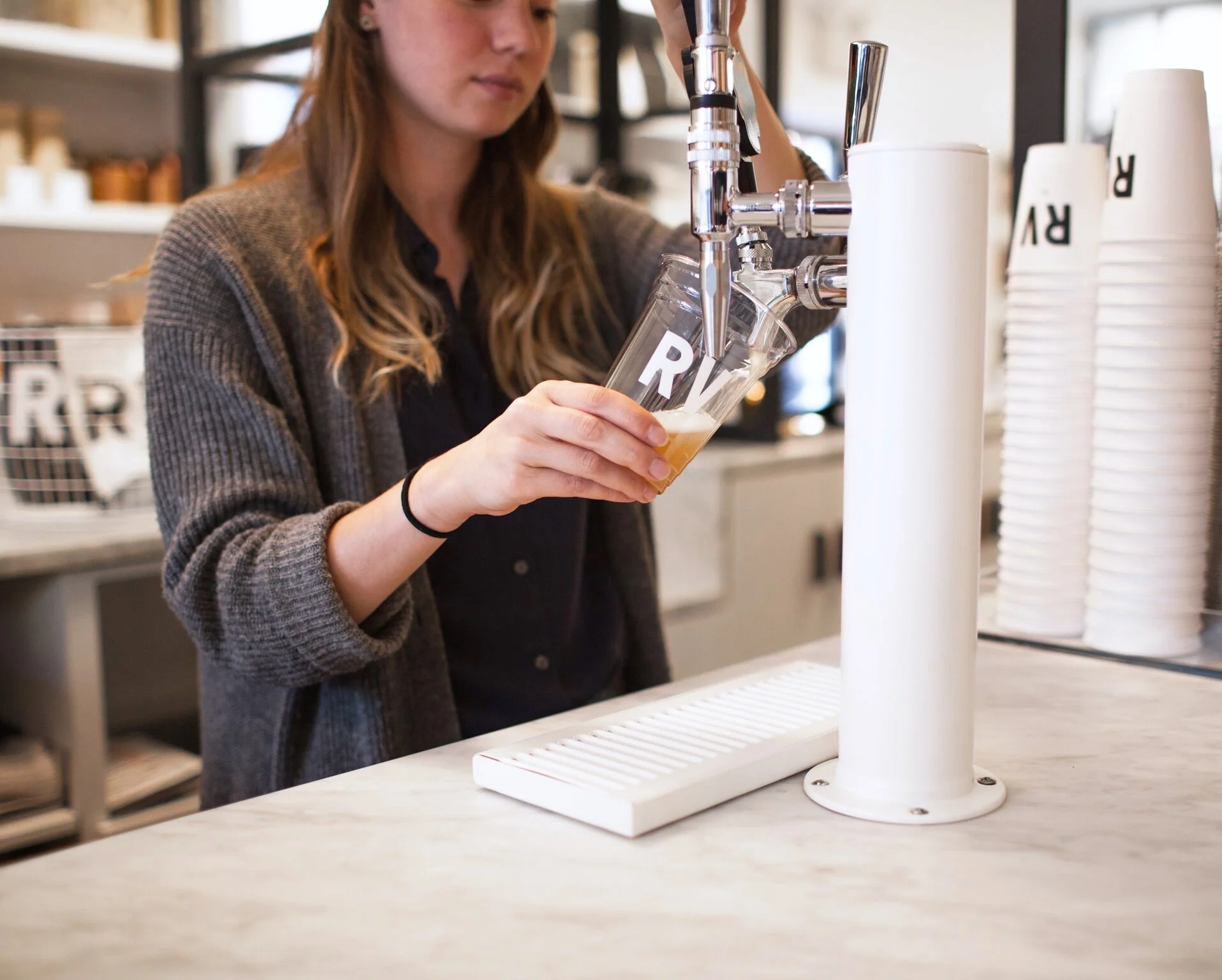 tap aesthetic movement graphic designer nyc regular visitors design branding logo boerum hill brooklyn retail stationery black white typography RV kombucha tap paper plastic cup cafe
