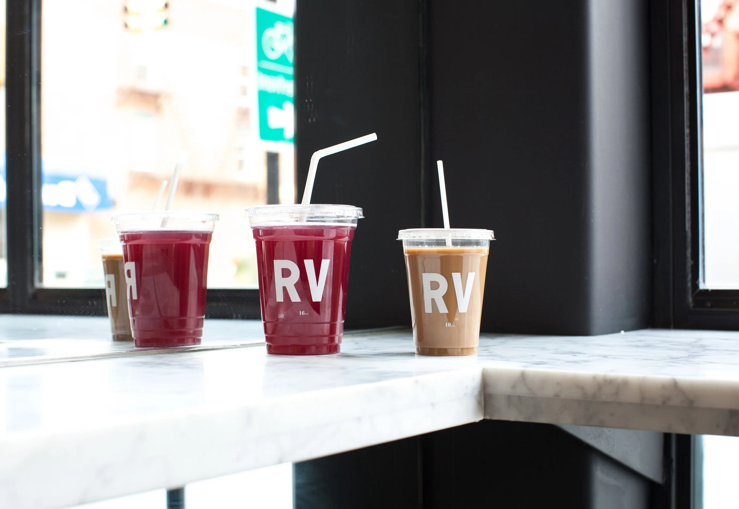 local aesthetic movement graphic designer nyc regular visitors design branding logo boerum hill brooklyn retail white typography RV plastic cups tea coffee marble counter to-go