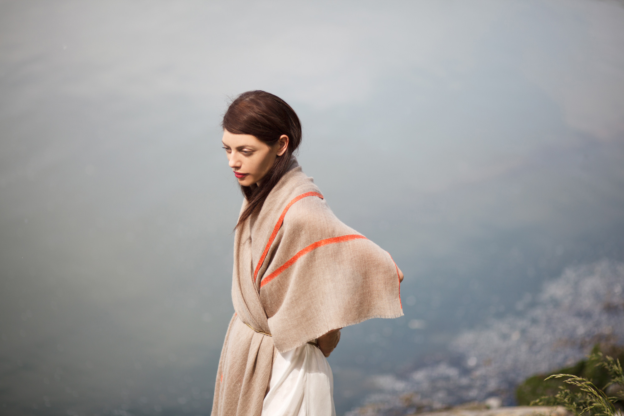 andraab catalog design photo shoot nyc art director accessories apparel shawls scarves scarf brunette model water orange detail