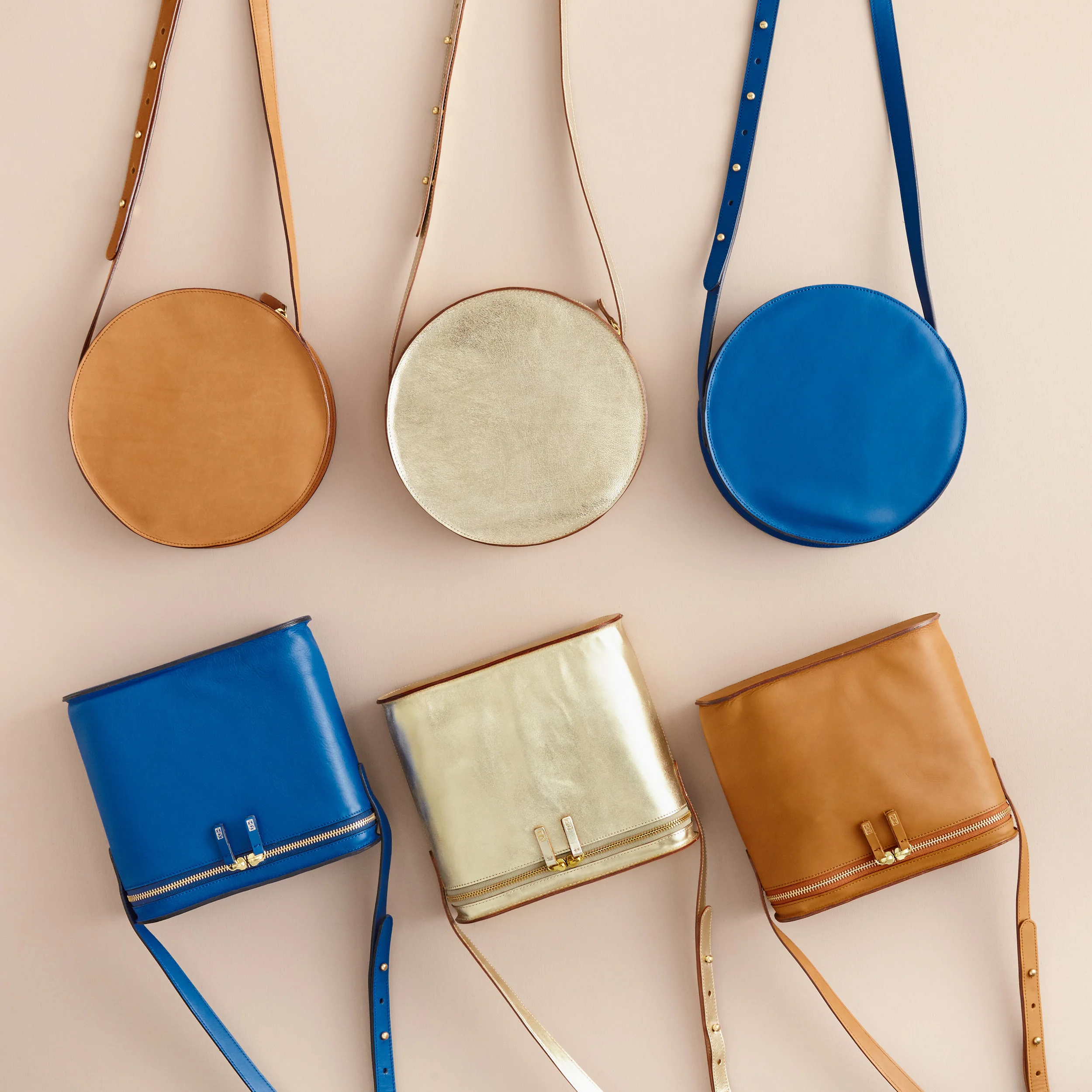 nyc graphic designer art director coachella travel MH minor history leather goods product accessories design moon radio crossbody bag purse blue gold saddle round carryall