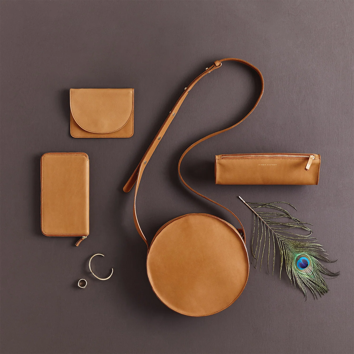 nyc graphic designer art director MH minor history leather goods product accessories design saddle feather jewelry wallet pouch crossbody moon round editorial carryall festival coachella travel