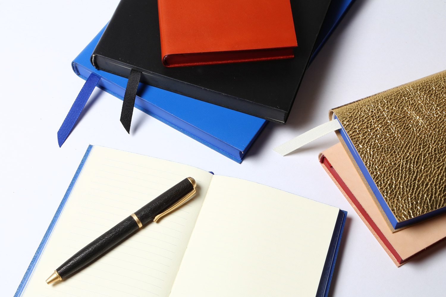 nyc designer graphic image x A/M Aesthetic Movement New York leather stationery journals pen gold blue black red design