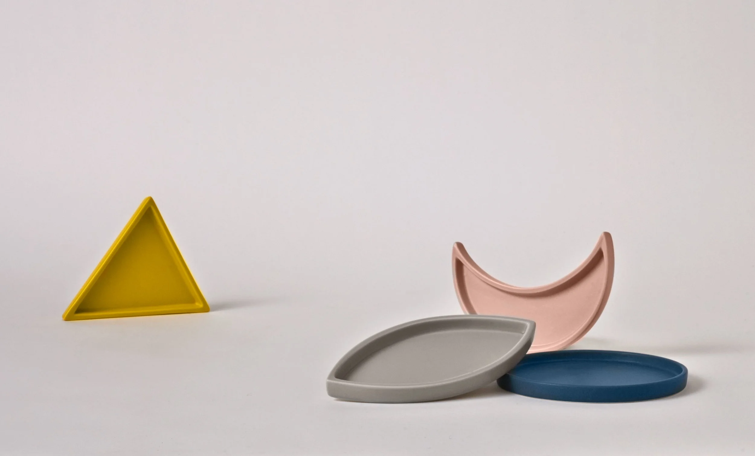 nyc art director dining kitchen catchall 1993 willie tsang ceramics colored product design tabletop collection triangle moon crescent tray