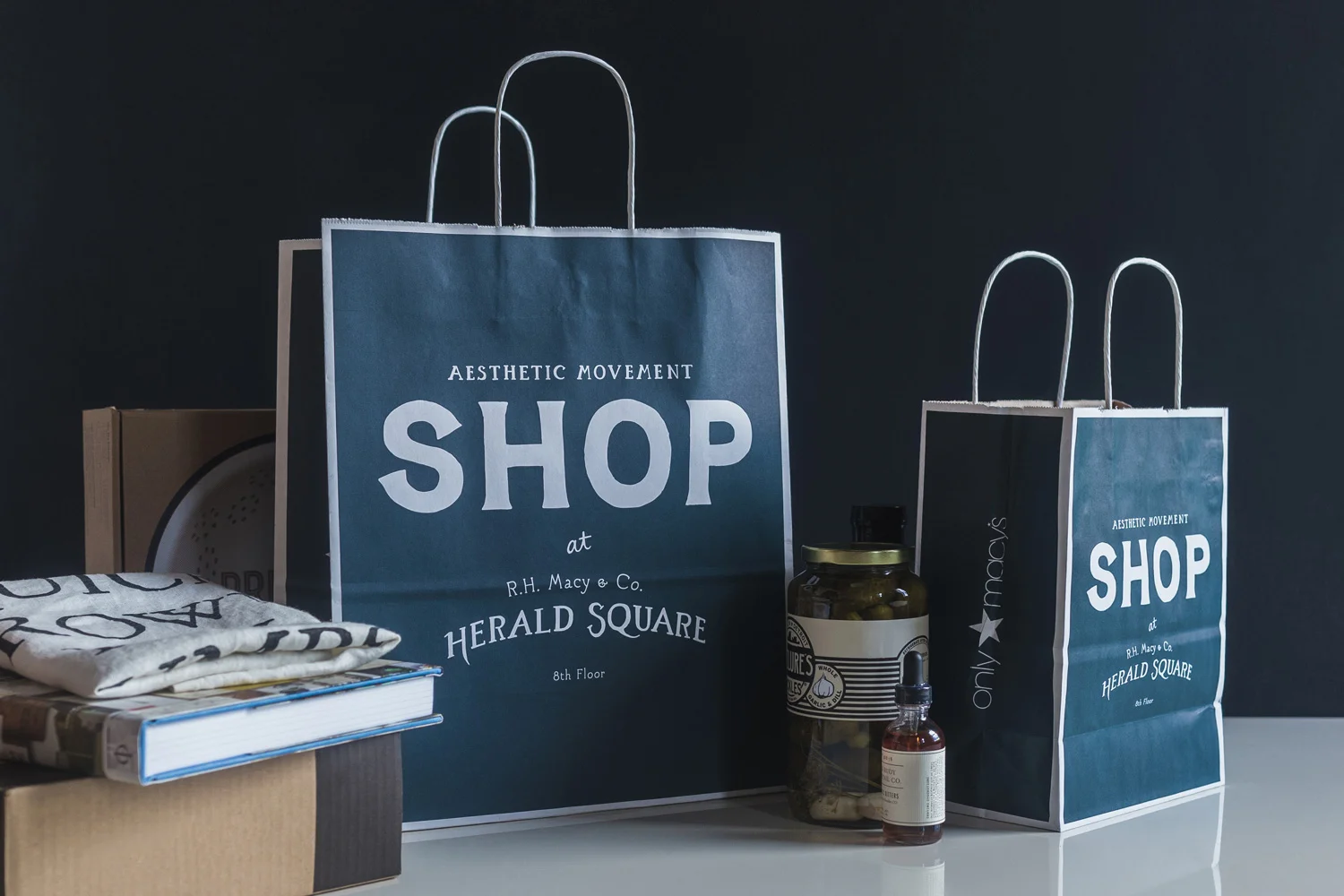 nyc graphic designer aesthetic movement shop macy's herald square design logo lockup identity branding blue bag gift wrap home 