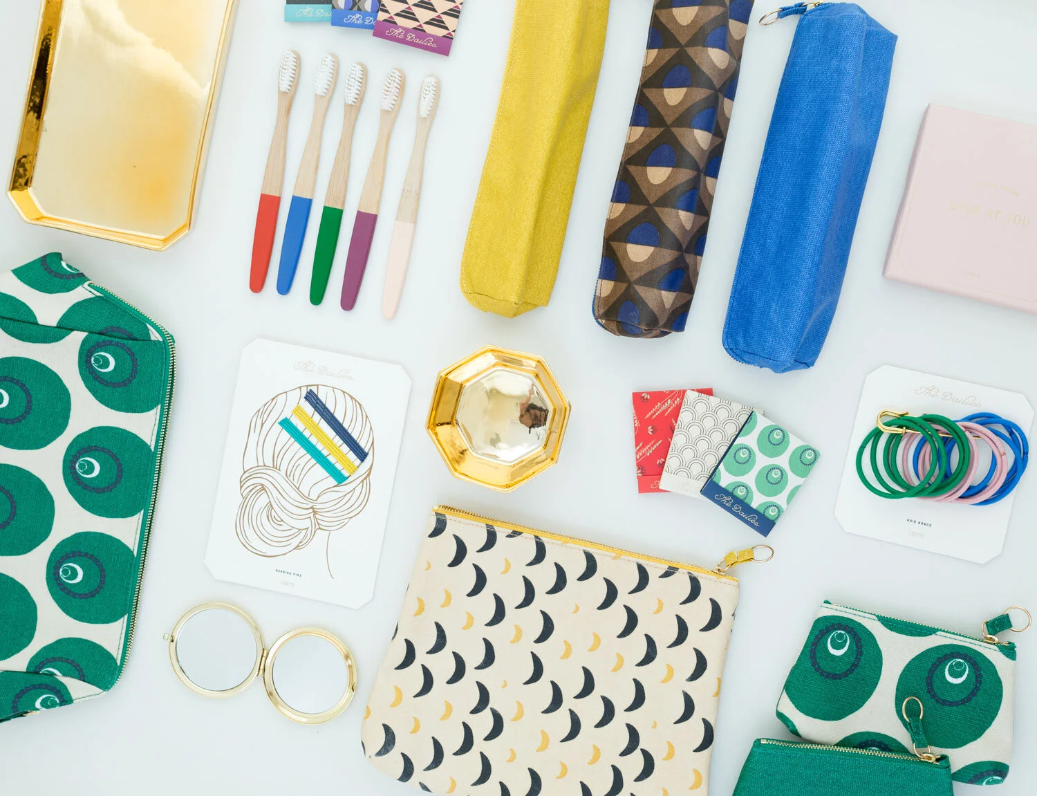 nyc graphic designer odeme design product development packaging colorful pattern accessories toothbrushes bobbing pins pouch moon crescent hair ties styling beauty women
