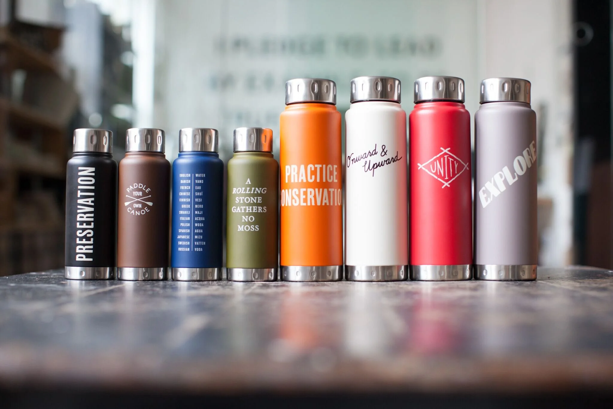 nyc graphic designer home gift izola design typography steel water bottles color explore onward upward unity preservation paddle canoe rolling stone moss conservation travel adventure hike beach road
