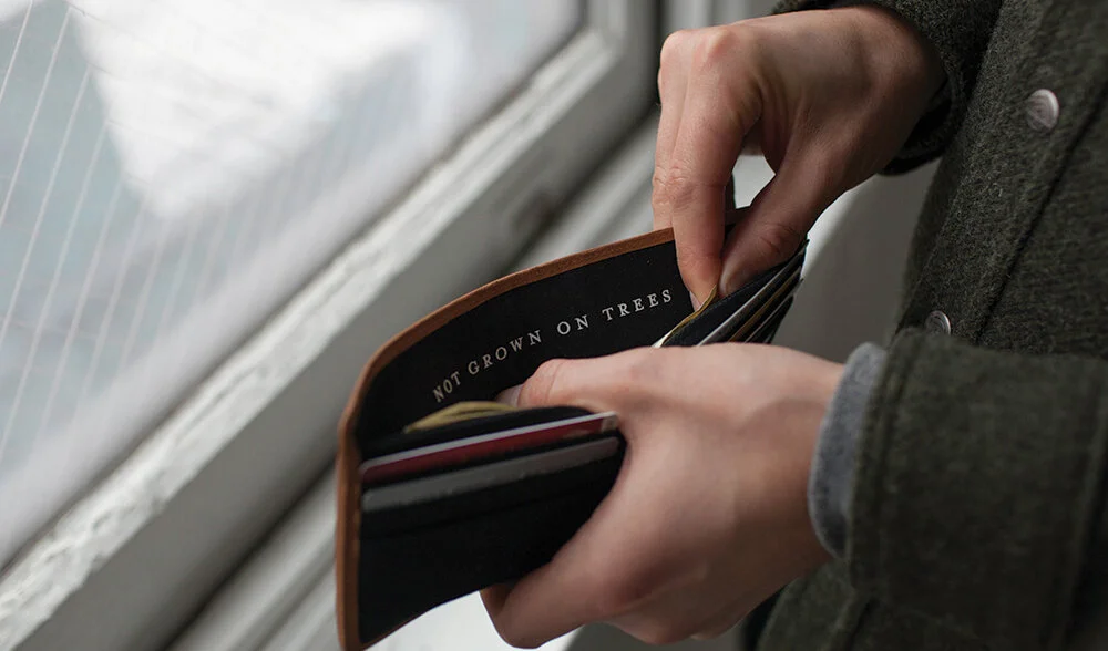 nyc graphic designer home gift izola design wallet canvas black not grown trees money hands payment dollars savings spending graduation job paycheck