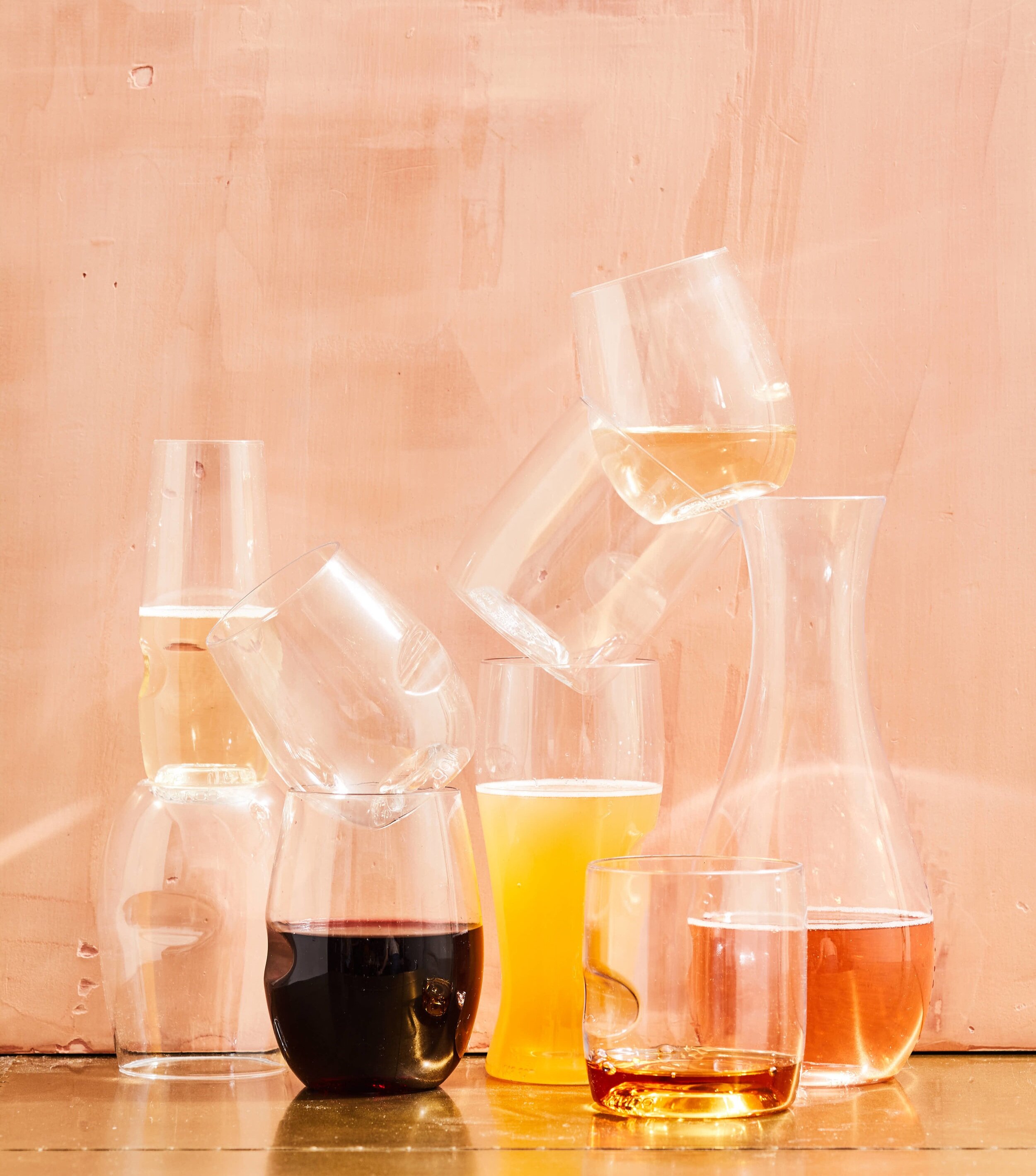 kate sears editorial nyc art director govino unbreakable wine glass decanter beer pink texture background gold bar cart