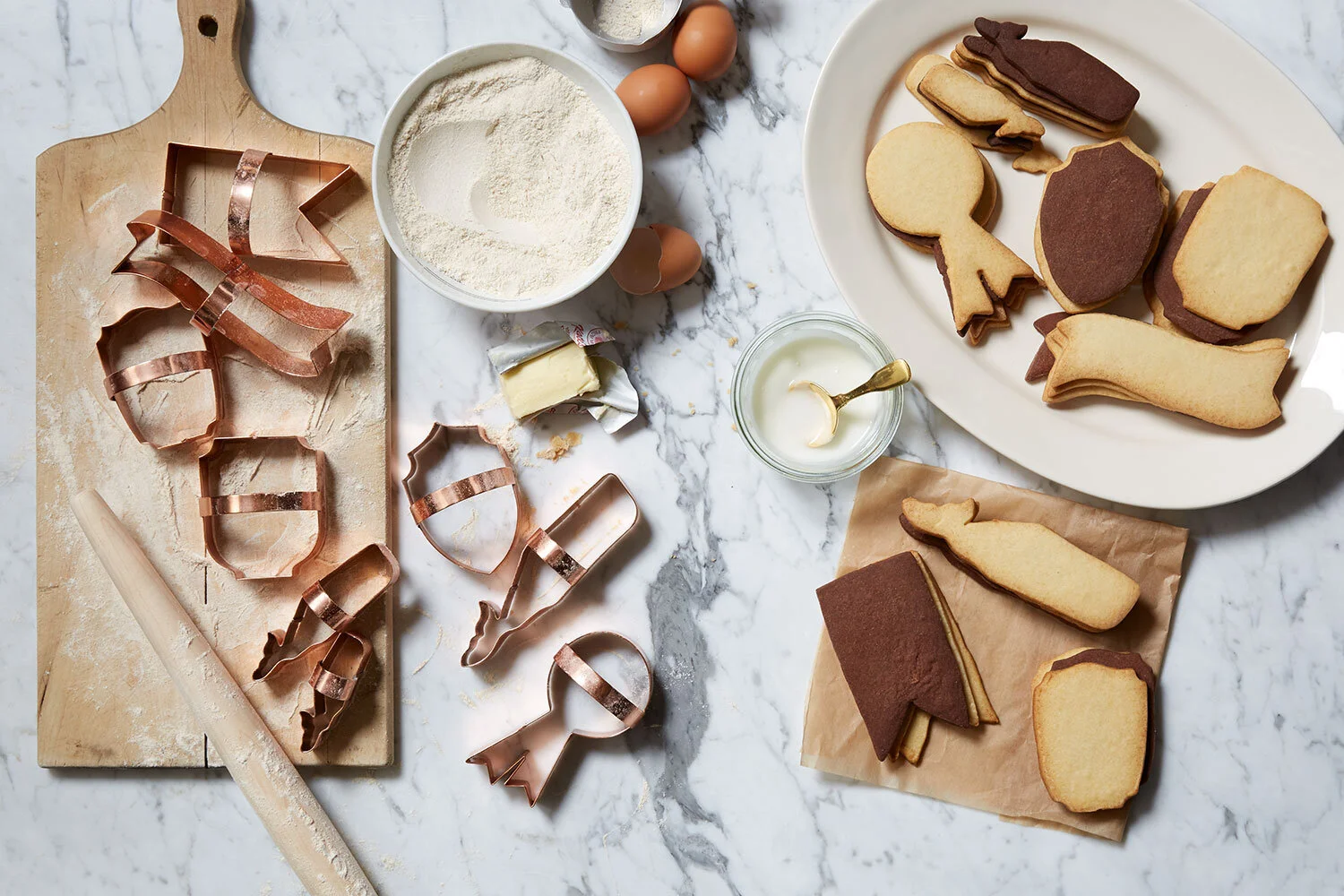 gift home kate sears aesthetic movement wholesale art director nyc sir/madam sirmadam copper cookie cutters ribbons shields whales ingredients flour egg rolling pin wood board marble baking