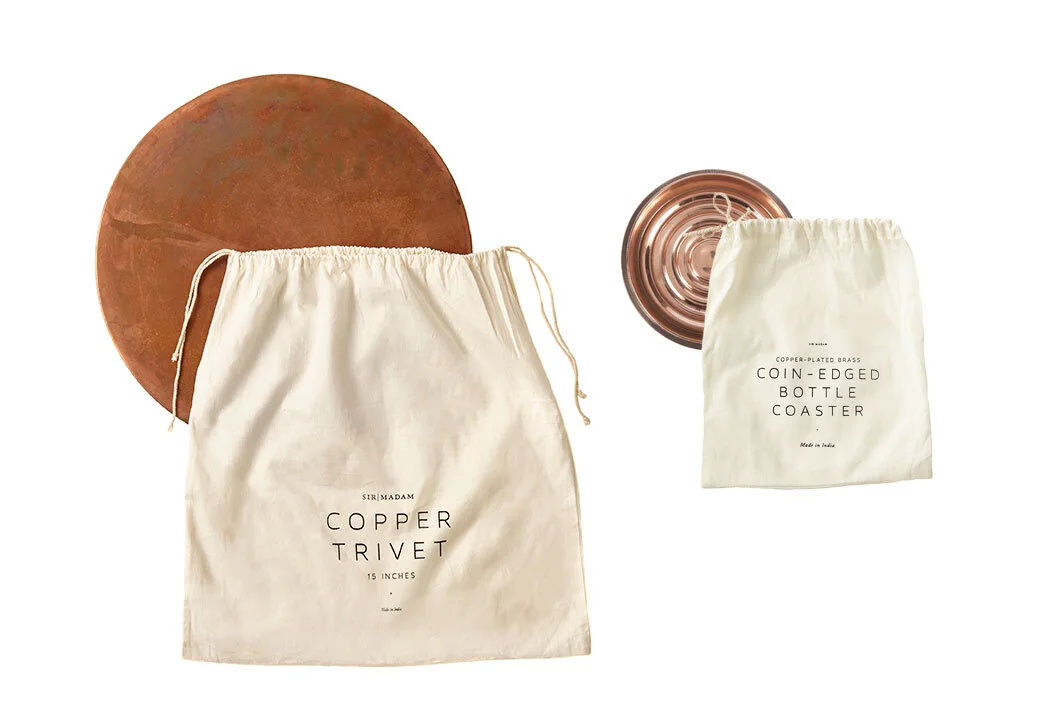 gift home aesthetic movement wholesale graphic designer nyc sir/madam sirmadam copper trivet bottle coaster packaging cotton drawstring printed bag black ink