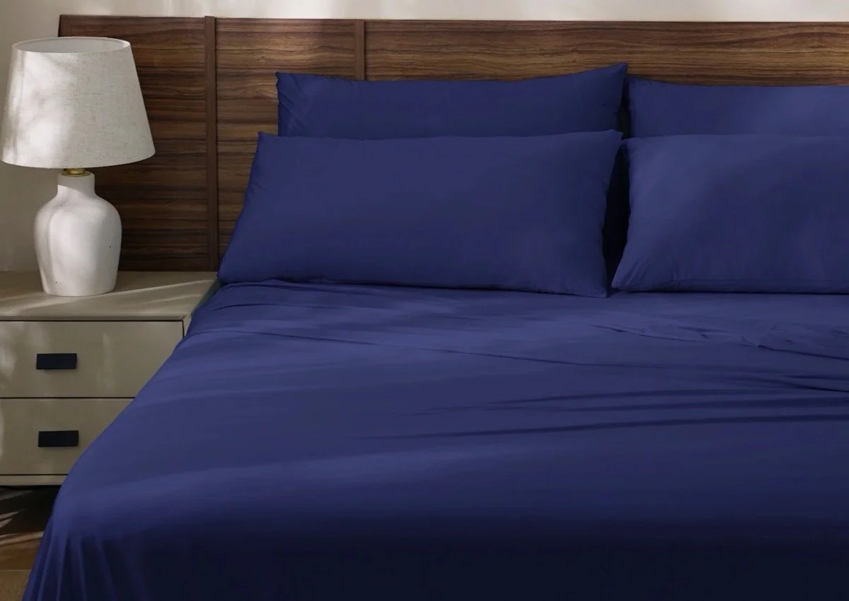 Rest Evercool+ Cooling Sheet Set in Midnight Blue on a bed