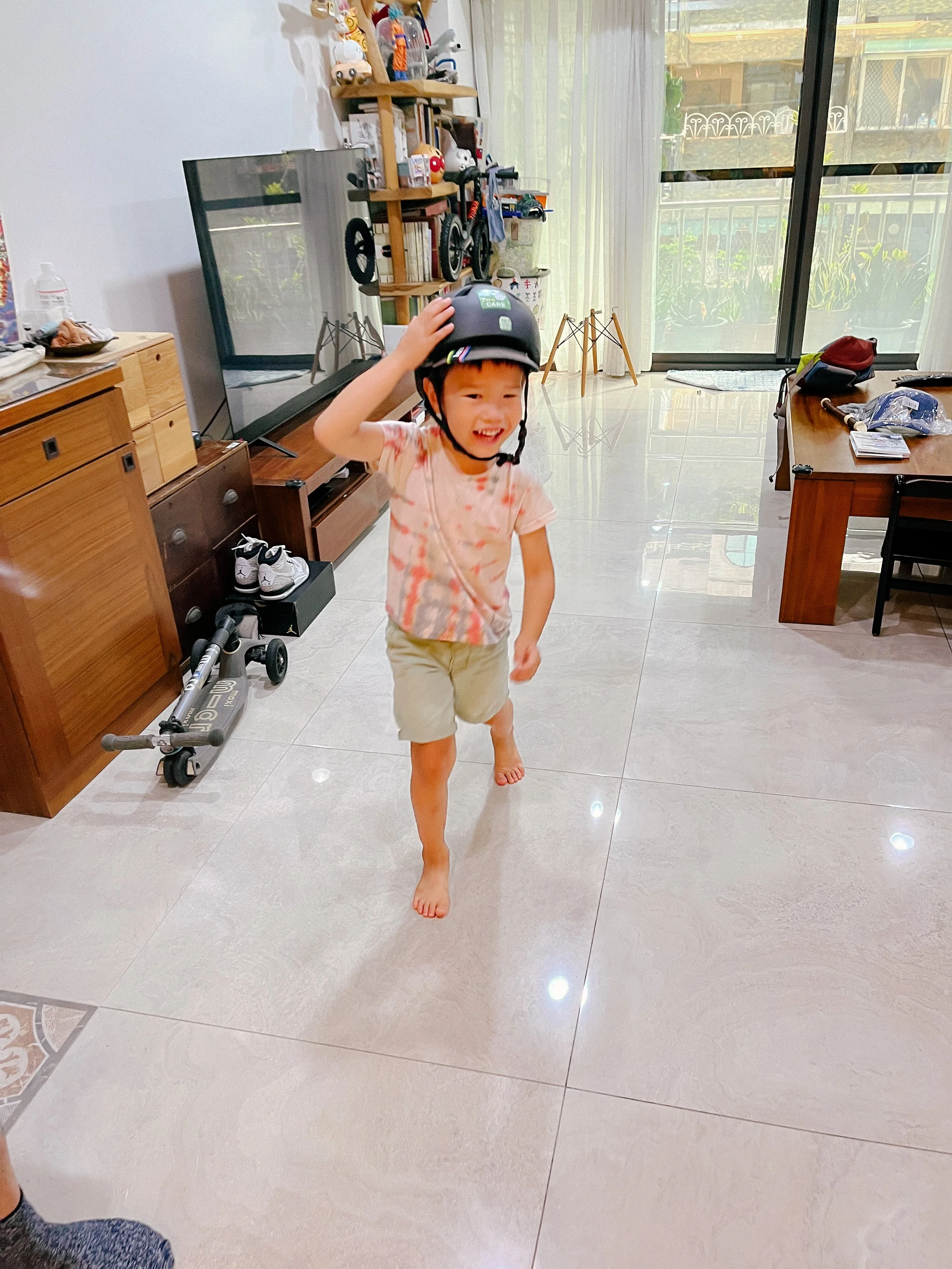 Sunny wearing motorbike helmet for the firs time!