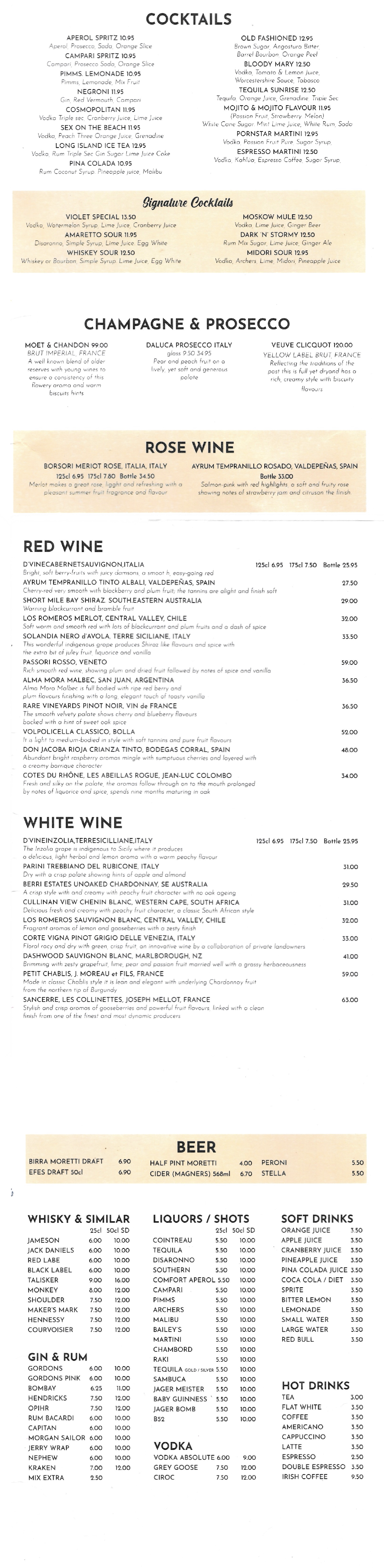 A printed cocktail and wine menu featuring sections for cocktails, champagne, prosecco, rosé, red wine, white wine, beer, whiskey, liquors, soft drinks, and hot drinks, with various drink names, descriptions, and prices.