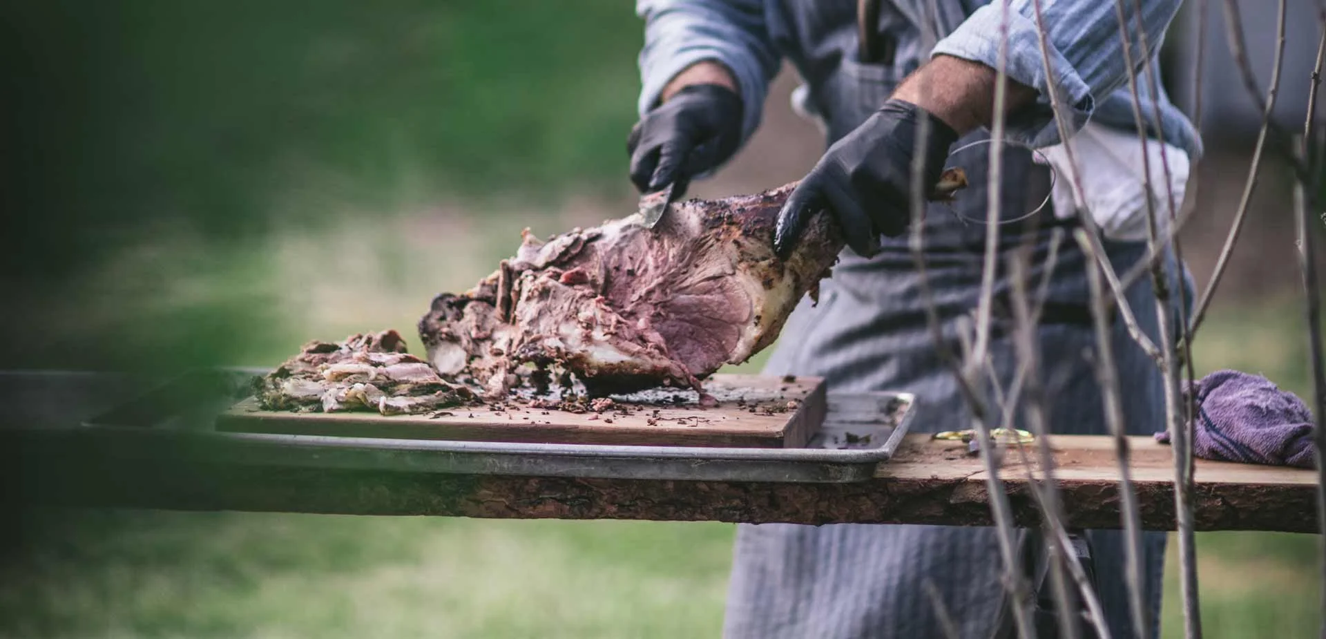 chef-cutting-lamb-at-outdoor-event.jpg