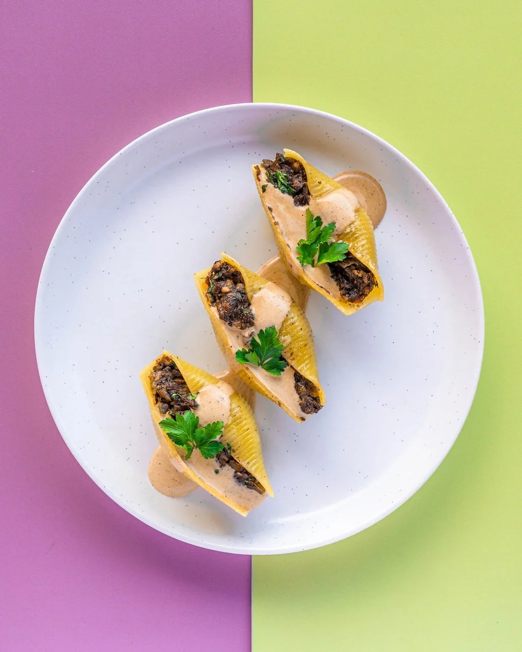 Vegheadsto Vegan  Mushroom sauce with three stuffed pasta shells on a plate