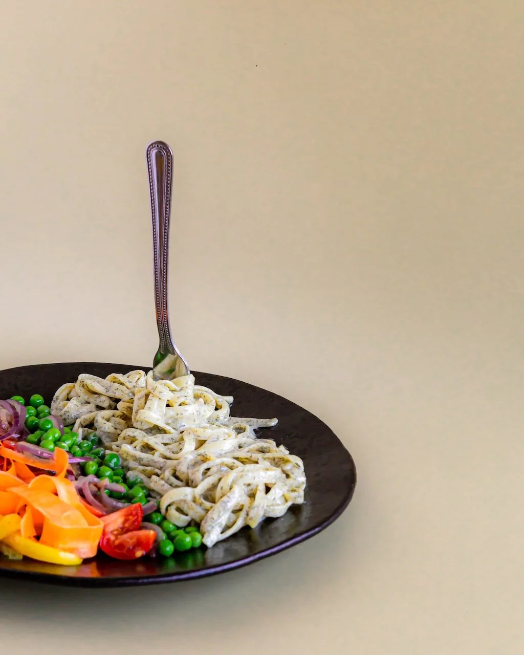 Vegheadsto Vegan Alfredo sauce on a plate with fork
