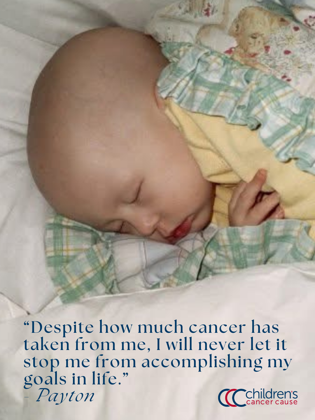 A young child with a shaved head sleeping peacefully on a bed, wearing yellow pajamas and covered with a patterned blanket.