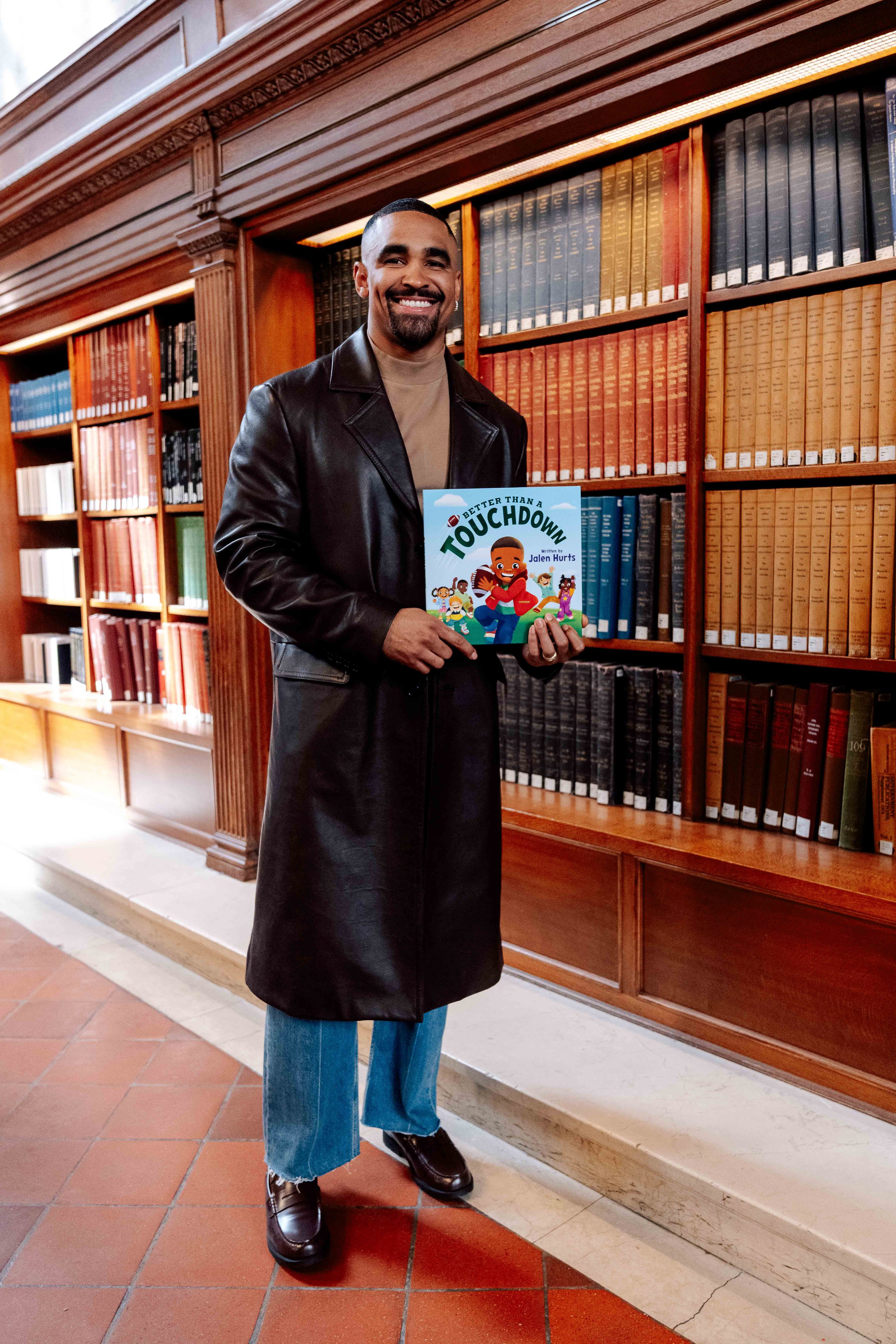 Jalen Hurts in a custom Coach look for his children’s book tour for, Better Than a Touchdown  | NFL