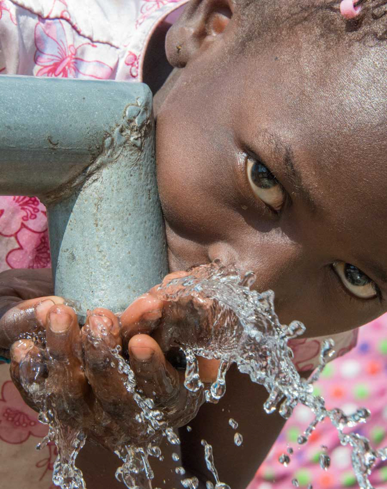 close up girl drinks from pump-.jpg