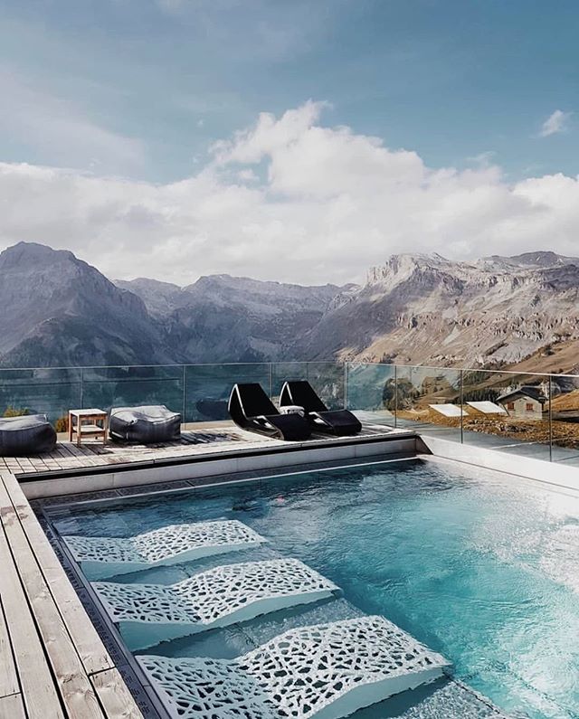 Soak in the views of Switzerland's Rh&ocirc;ne Valley from the heated pool at @chetzeronhotel. A blissfully quiet apres-ski soak, only reached by foot, ski or snowmobile. @travelita