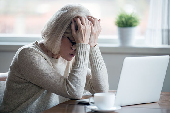 frustrated-Middle-aged-Woman-In-Front-Of-computer.jpg