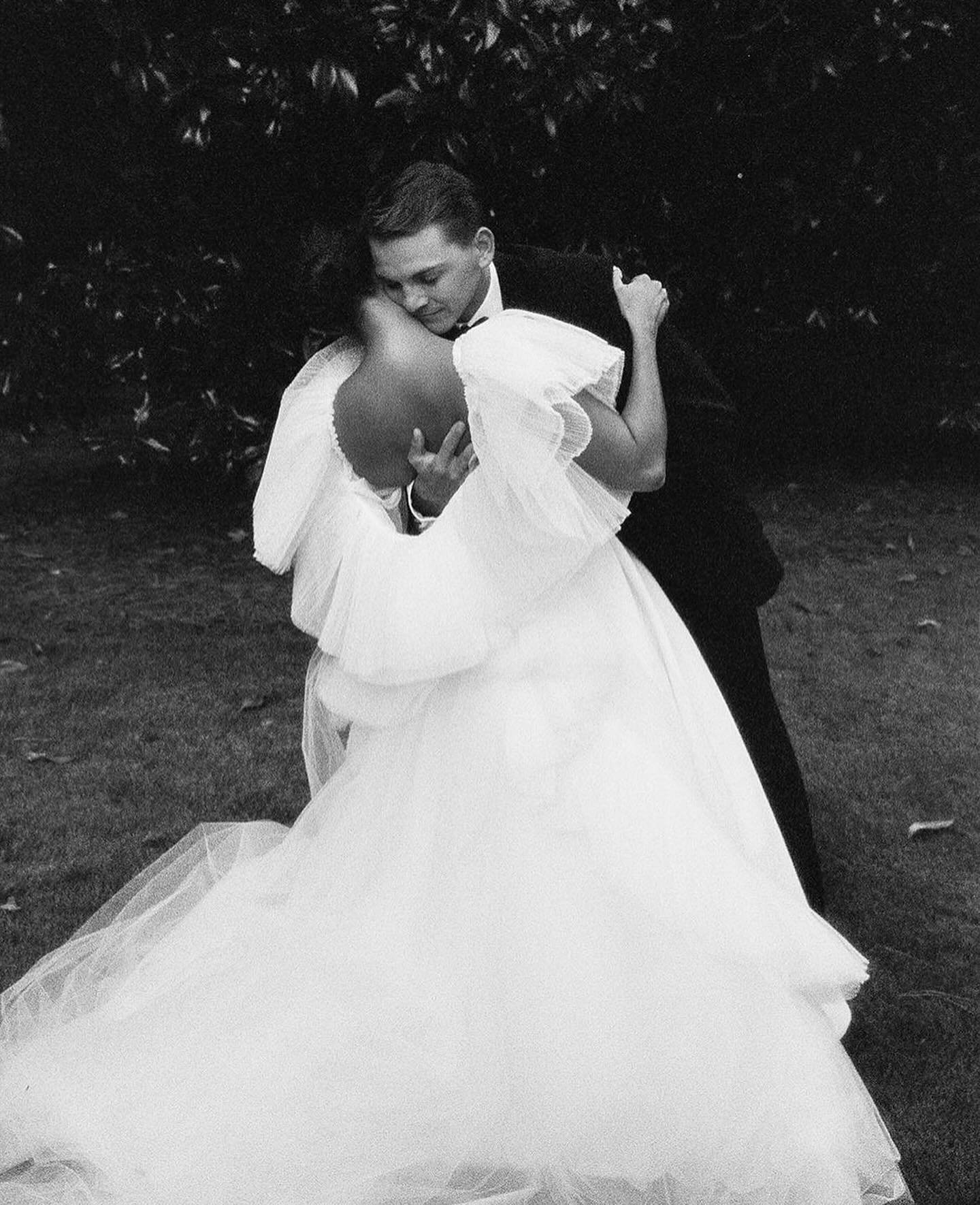 Falling in love is a freakin&rsquo; miracle. Hug your person and hold &lsquo;em tight 🖤 Swipe to see #asentimentalbride wearing an epic @varca.bridal cape and the incredible &ldquo;Kennedy&rdquo; gown by @rebeccaschoneveld_bridal 💅 #atlantabride #w