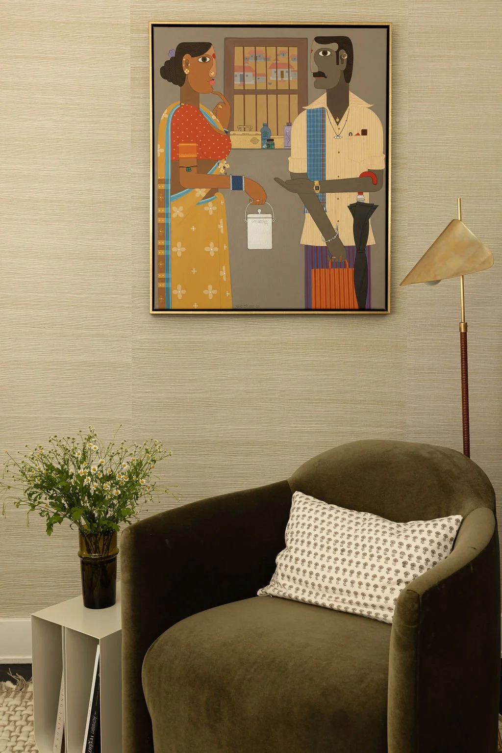 Indian artwork with lounge chair and side table