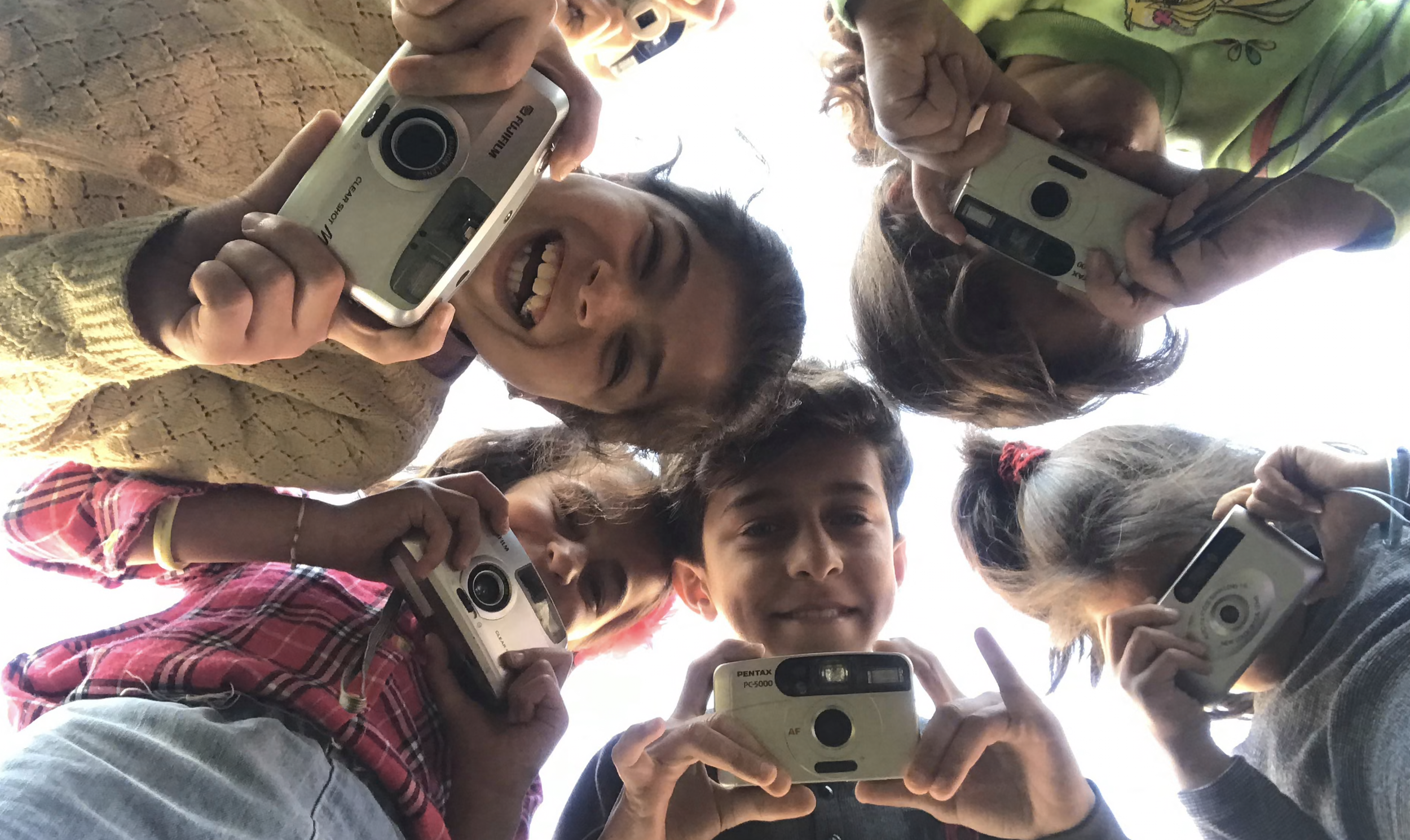 ‘Something magical happens’: the cameras helping refugee children to heal