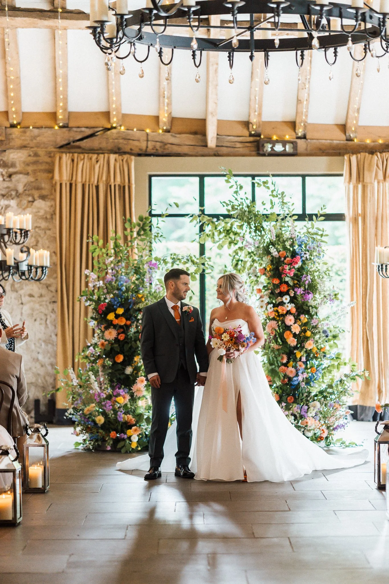 bright and colourful asymmetric floral arch at the Tithe Barn, Bolton Abbey, Yorkshire